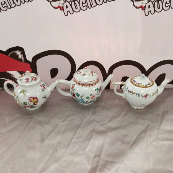 Franklin Mint porcelain teapot collection featuring a colourful floral design.