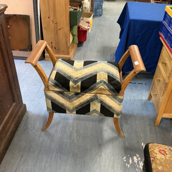 Antique French Regency walnut stool with patterned upholstery.
