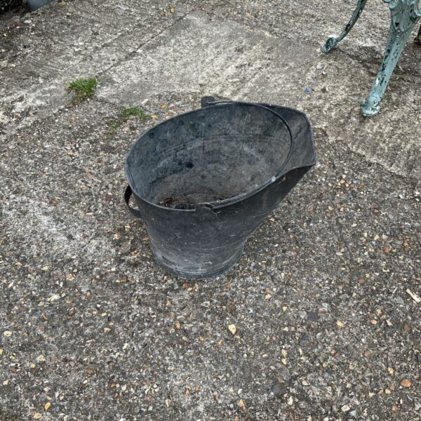 Vintage galvanised coal bucket with handle, ideal for fireplace use.