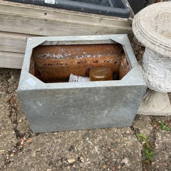 Vintage galvanised water tank for farm or garden use.