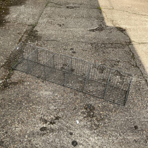 Vintage galvanised wire shelf for storage and display.