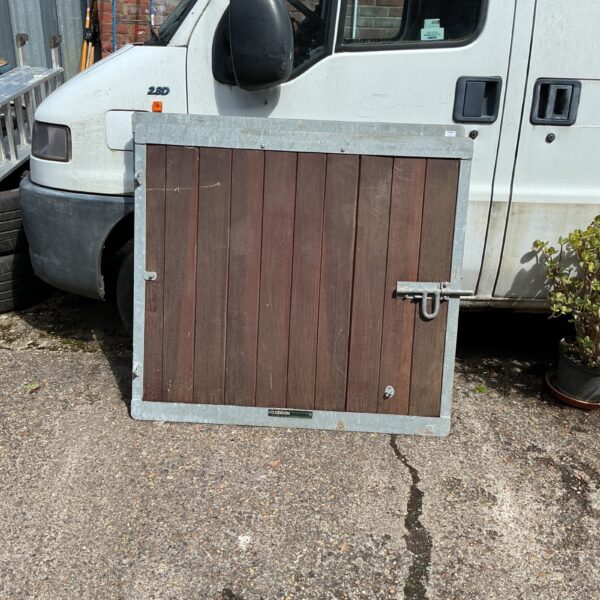 Rustic metal garden gates, 46x42 inches, showing signs of weathering.