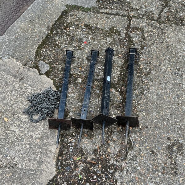 Vintage metal garden posts with chain for garden edging.