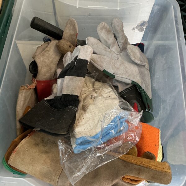 Mixed lot of used gardening and work gloves for garden and DIY tasks.