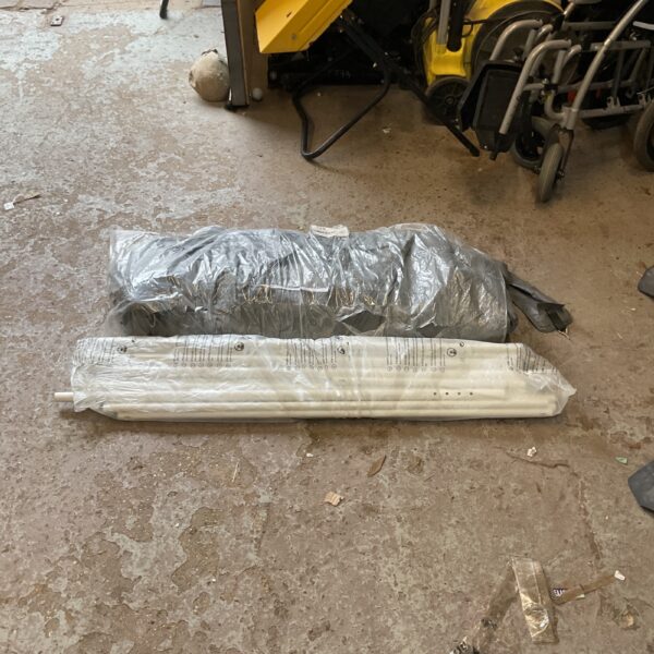 Packaged gazebo parts for garden structure assembly.