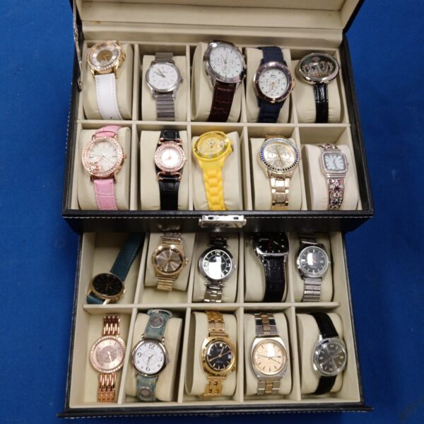 Gents watch collection displayed in a case, including Timex and Lamar brands.