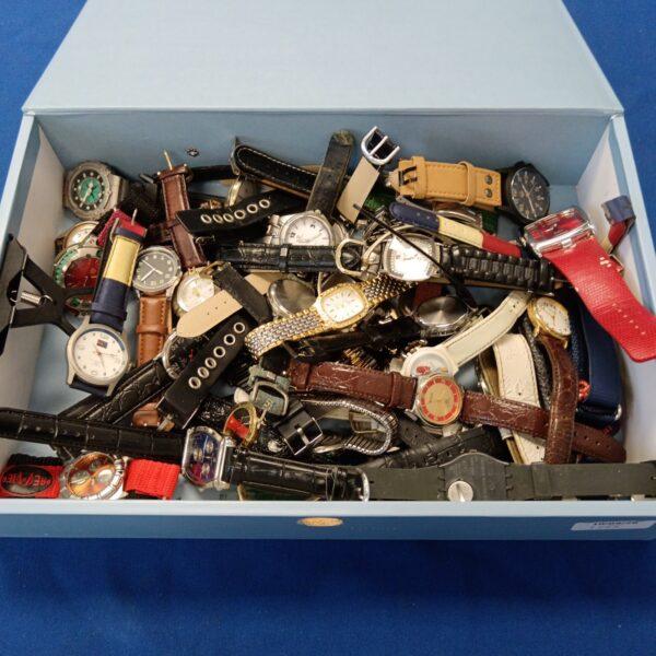 Gents watch collection including Swatch and Guess timepieces.