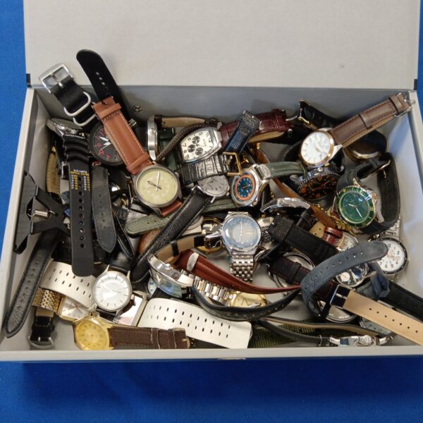Gents watch collection lot featuring vintage Ingersoll and Penguin timepieces.
