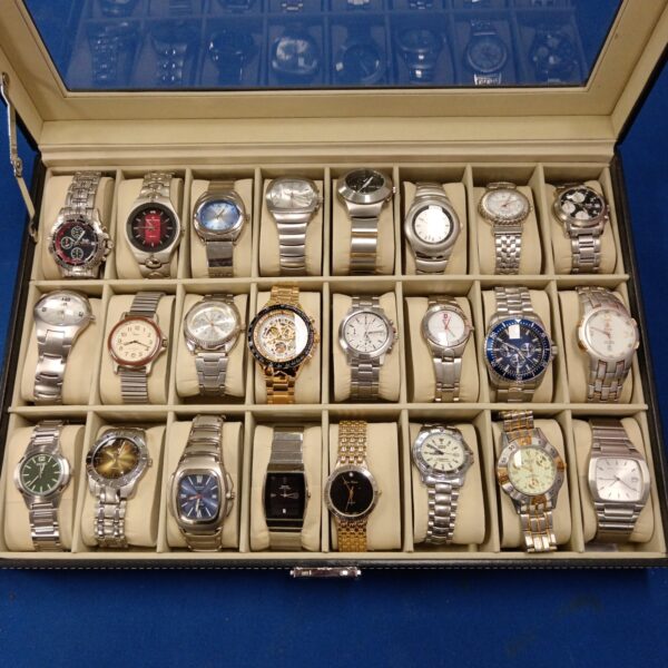 Gents watch collection featuring Seiko and Guess timepieces.