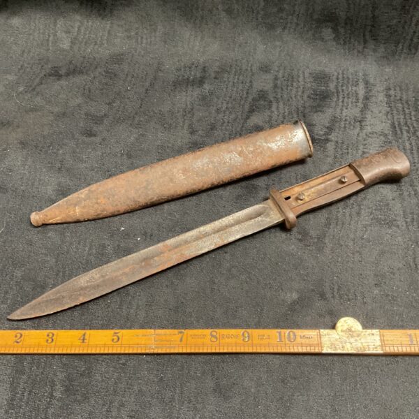 Vintage German bayonet with steel blade, a collectible military artifact.