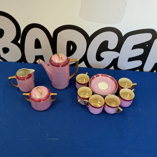 Vintage German porcelain coffee set in pink with gold details.