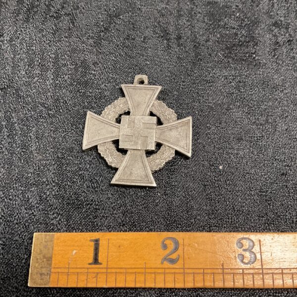 Front view of a vintage German War Merit Medal.