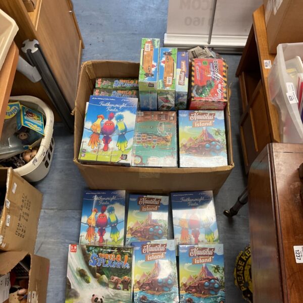 Sealed lot of GiGaMic games including Featherweight Fiesta and Nautilus Island.