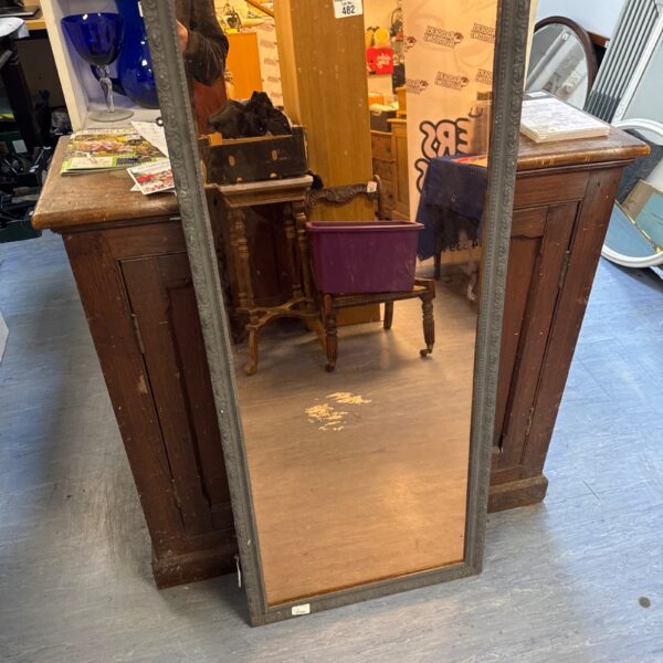 Vintage gilt framed mirror with tinted glass for wall decor.