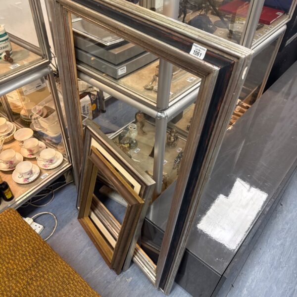 Lot of three antique gilt picture frames for display.