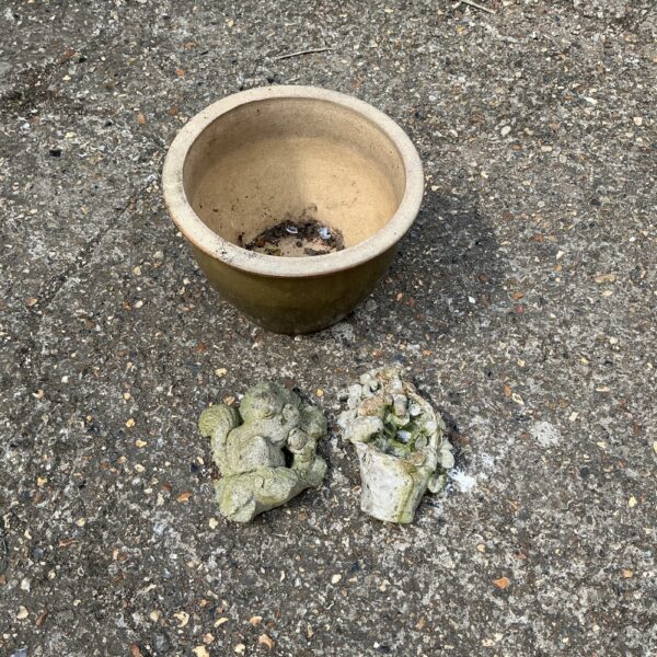 Vintage glazed terracotta garden pot with wall ornaments for garden decor.