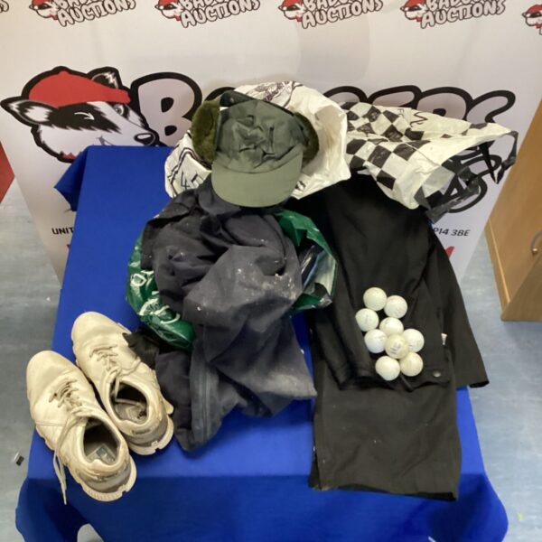 Golfing attire assortment featuring Adidas Pro SL trainers and golf balls.