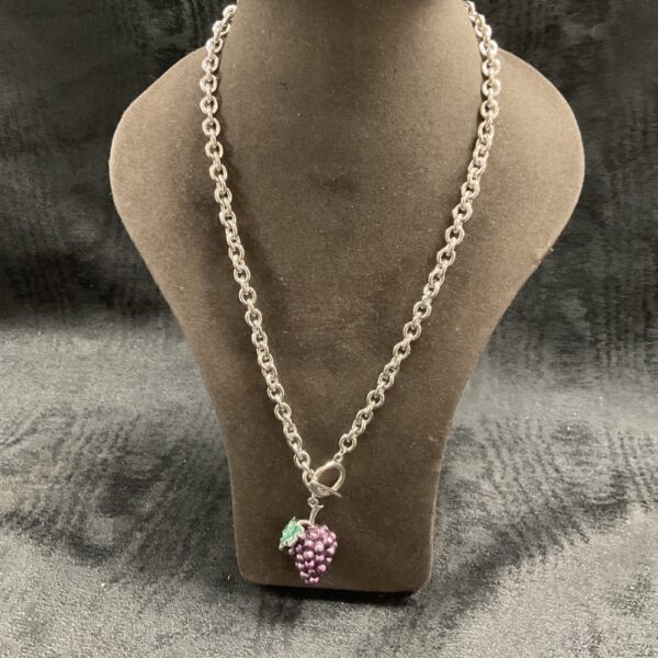 Purple grape pendant necklace on a T-bar chain.