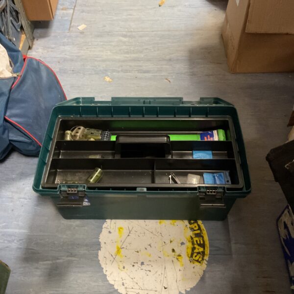 Green Lemco fishing tackle box with open trays and fishing accessories.
