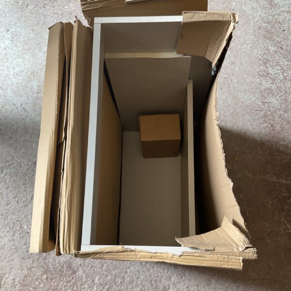 Grey linen vanity unit packaging, showing wear and tear.