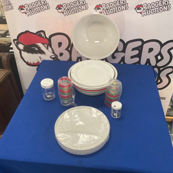 Vintage Guzzini plates and cups set displayed on a blue table.