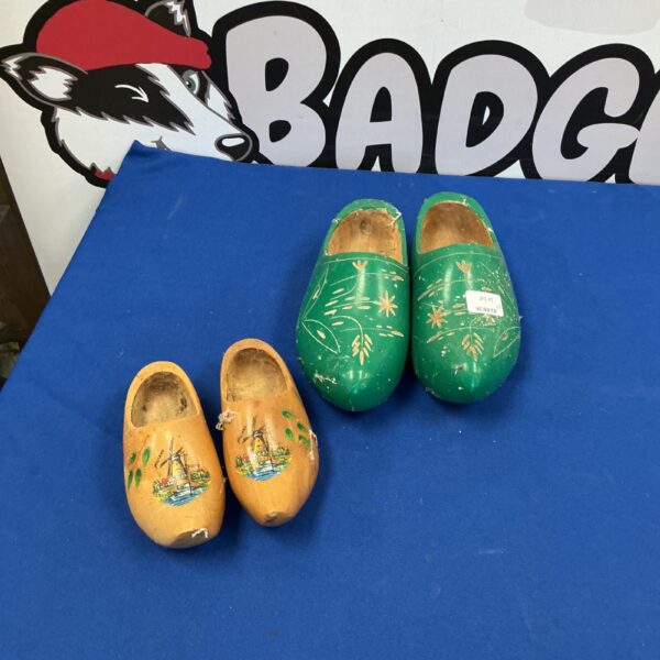 Hand-painted Dutch wooden clogs with floral designs.