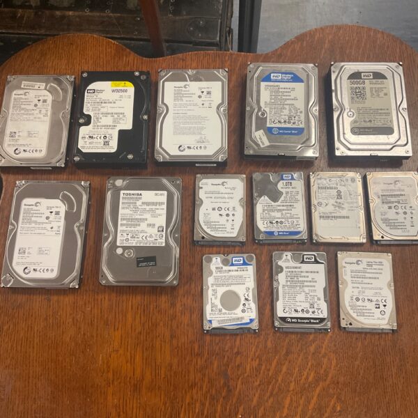 Mixed lot of internal hard drives for computers and data storage.