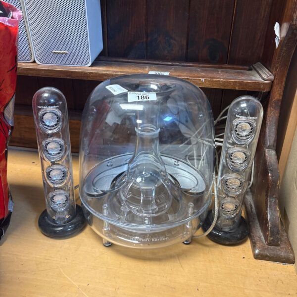 Harman Kardon SoundSticks III speakers, clear acrylic design.