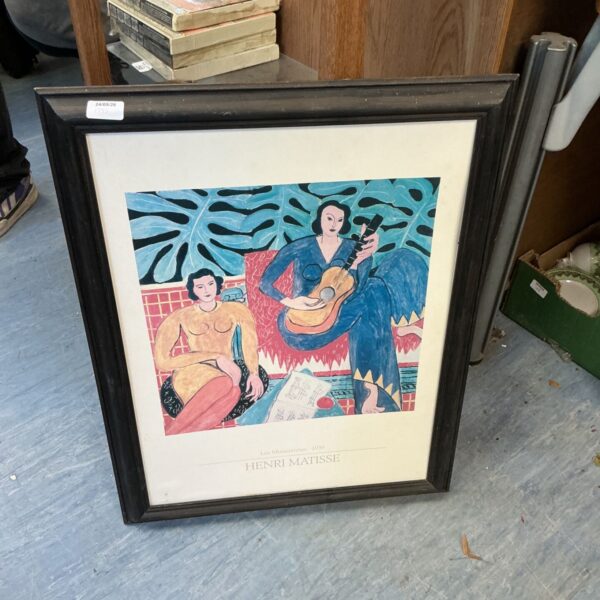 Framed Henri Matisse style print of a guitarist.