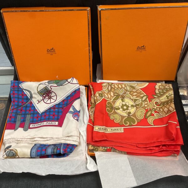 Hermes Paris silk scarf lot, vibrant colours and intricate designs.