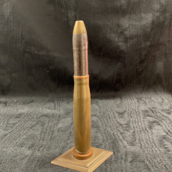 WW2 Hispano 20mm shell display, a vintage military collectible.