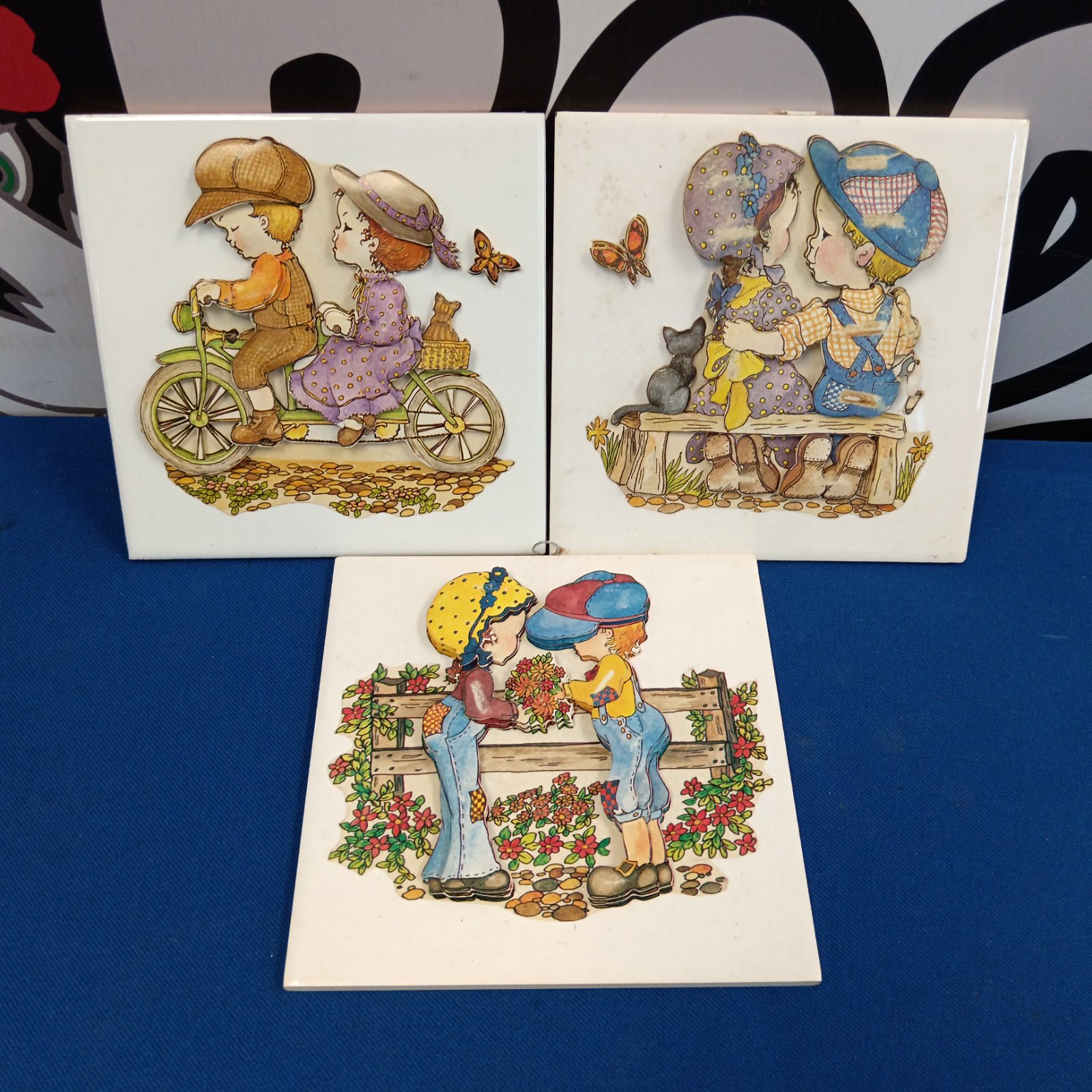 Vintage Holly Hobby tile featuring a girl on a bicycle.