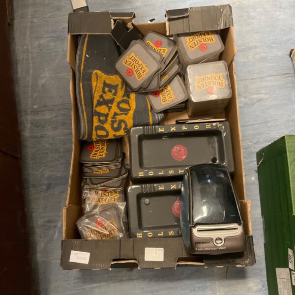 Vintage Holstein Export memorabilia lot with coasters, towels, and Dymo printer.