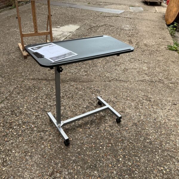 Black Homcom bedside table with wheels for laptops and books.