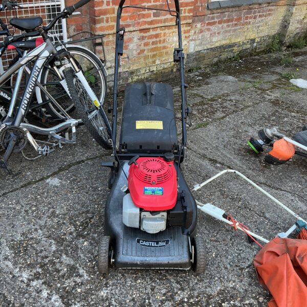 Honda Castel Plus 5.5 petrol lawnmower in used condition.