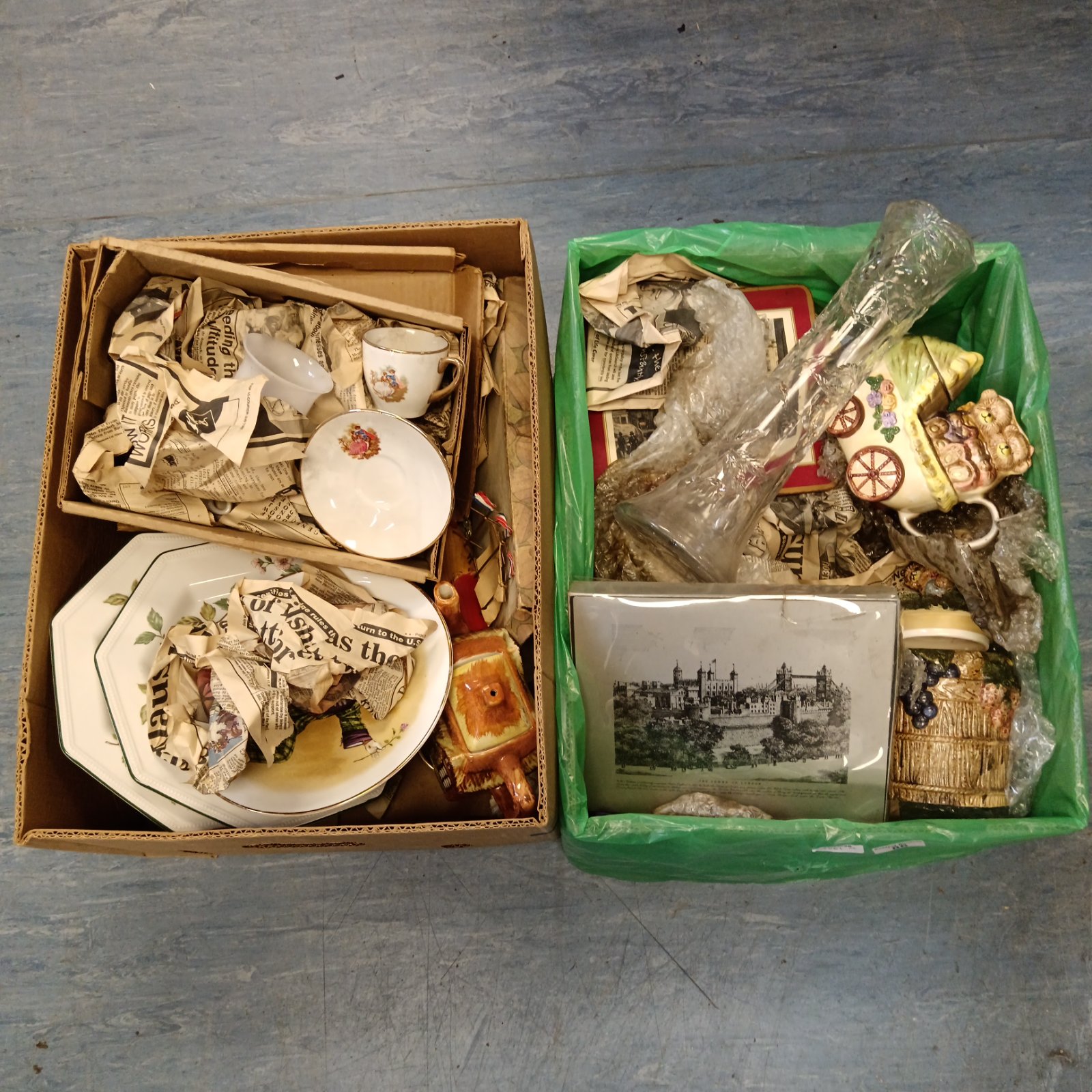 House clearance lot with boxes of vintage china and collectibles.