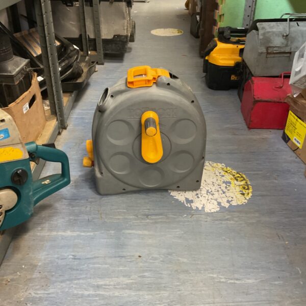 Hozelock compact hose reel for garden hose storage.