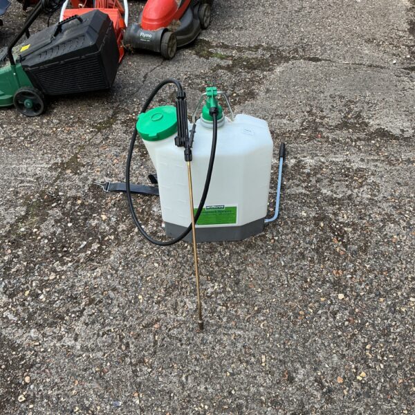 Used Hozlock knapsack sprayer with red lawnmower in background.