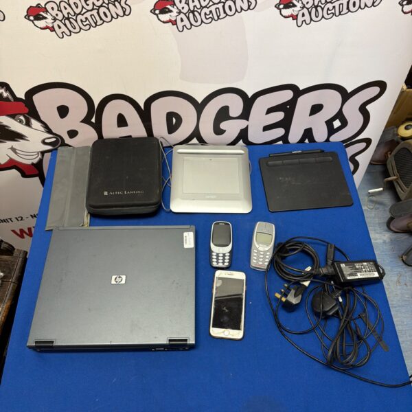 Mixed electronics lot featuring HP laptop and Nokia phone.