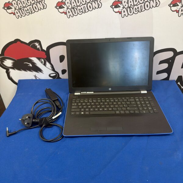 Blue HP Stream laptop with charger, presented for auction.