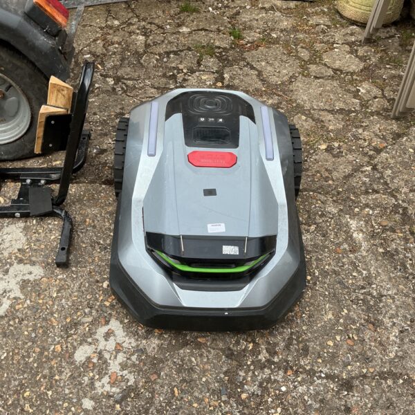 Husqvarna Automower robot lawnmower in a garden setting.