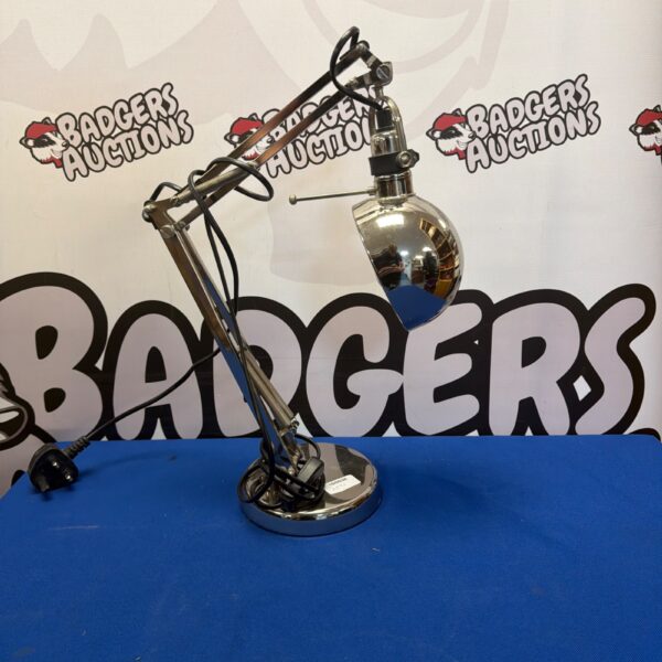Chrome IKEA FORSA desk lamp with adjustable arm.
