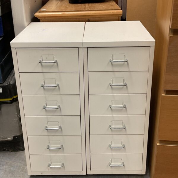 White IKEA HELMER drawer units for office or bedroom storage.