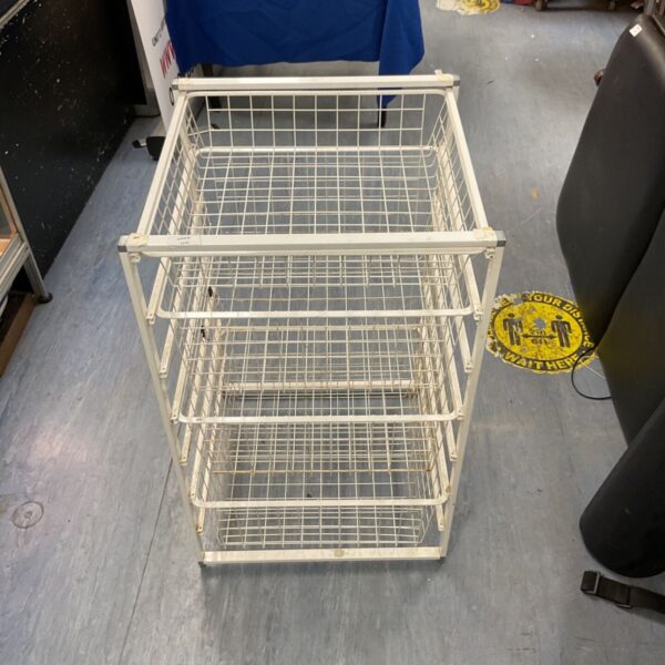 White IKEA JONAXEL storage combination with four wire baskets.