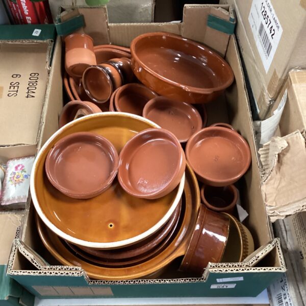 Tray full of terracotta style dishes