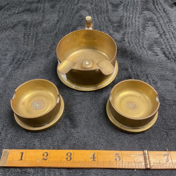 Two trench art cannon shell ash trays inc 1915 F R Neumeyer nurnberg