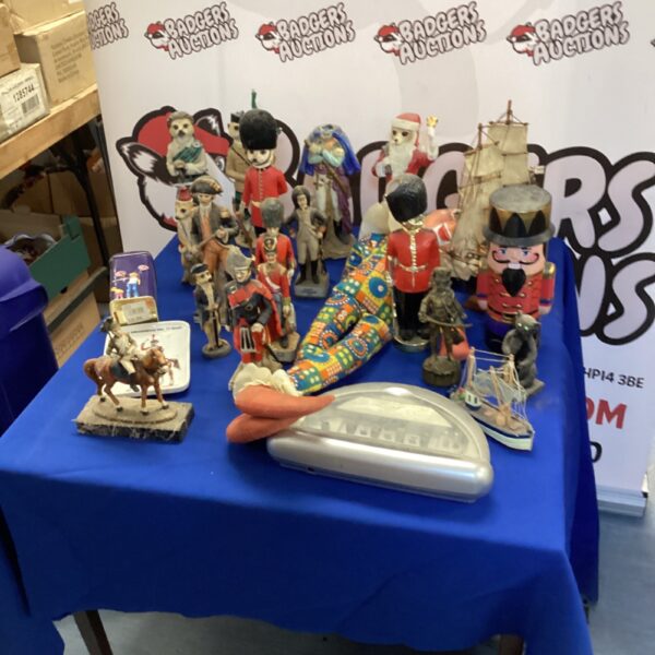 A box of mixed ornaments, including meerkat characters (some chipped) & rubber faced harlequin