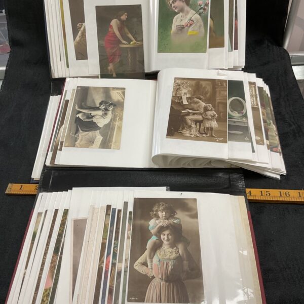Two folders of vintage postcards