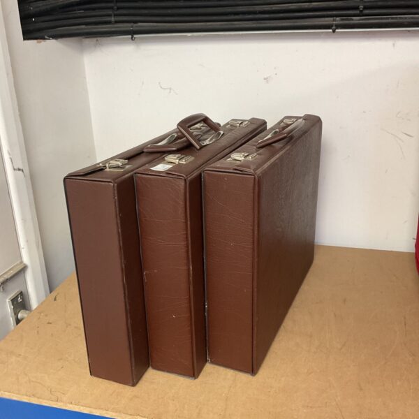 Three brown leather briefcases