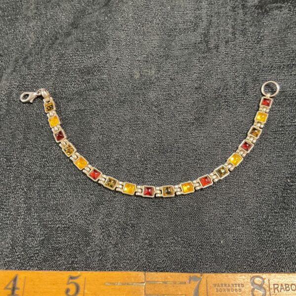Silver tone amber colour stone bracelet